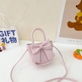 Pink PU leather crossbody bag featuring a large bow knot and top handle for girls - Pink