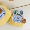 Quilted yellow child backpack featuring blue checkered flap and plush bear charm - Small