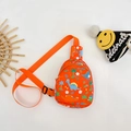 Levendige oranje canvas crossbodytas voor kinderen met schattige dinosaurusprint - Oranje