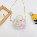 Kids beige lace crossbody bag featuring pearl handle and cartoon princess doll charm - Off White