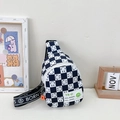 Kids black and white checkerboard chest bag with smiley pin and letter strap - Black