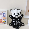 Cute black and white plush skull backpack with soft faux fur and bone pattern details - Black