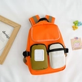 Lightweight orange canvas backpack for kids with green and white front pockets - Orange