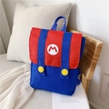 Mochila infantil roja y azul con logo M blanco y botones amarillos decorativos - Rojo