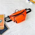 Vibrant orange nylon kids chest bag with adjustable black straps and spacious pockets - Orange