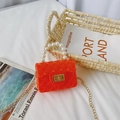 Mini orange jelly crossbody bag with pearl handle and quilted texture for kids - Orange