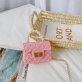 Pink mini jelly bag for girls featuring pearl handle, woven texture, and gold chain strap - Pink