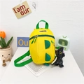 Sac à dos dinosaure jaune pour enfants avec ailettes vertes et pendentif peluche - Jaune & Vert