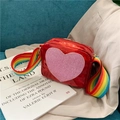 Glossy red patent leather kids crossbody bag with pink glitter heart and rainbow strap - Red