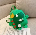 Mochila infantil de dinosaurio verde con corona amarilla y detalles rojos decorativos - Backpack / Verde