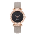Detail of rose gold alloy watch case with starry dial and minimalist diamond bezel - Gray