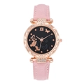 Detailed macro view of butterfly dial with rhinestones on rose gold women's watch - Pink
