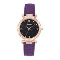 Detailed macro view of purple leather strap and rose gold rhinestone case of the watch - Purple