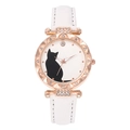 Close-up of rose gold cat watch with crystal bezel and white leather strap - White