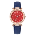 Detail of rose gold watch with sparkling red floral dial and navy blue frosted strap - Blue