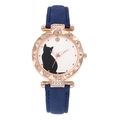 Close-up of rose gold rhinestone bezel and cat pattern dial on blue leather watch - Blue
