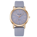 Detailed macro view of the rose gold case and purple frosted dial of this quartz watch - Light Blue