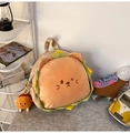 Close-up of plush burger cat backpack with green lettuce trim and a mini burger charm - Small With Pendant