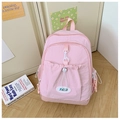 Detailed view of pink school backpack with drawstring pocket and smooth zipper texture - Pink