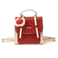 Zaino chic rosso a pois da donna con spallacci regolabili e ciondolo a forma di mela - Rosso