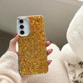 Dettaglio della custodia trasparente con paillettes glitter oro e arancio e bordo fotocamera argento - A16 / Cornice Galvanizzata - Colla a Goccia con Glitter Colorati - Oro