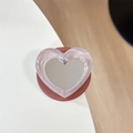 Macro shot of heart-shaped glitter phone grip with integrated makeup mirror surface - Pearl Heart Mirror-Brown