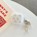 Detail of AirPods case with rhinestone cherries, pearls, and a silver bow pendant - Glitter Silver Bead White Rhinestone Cherry With Pendant / AirPods 1/2 Gen