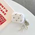 Close-up of clear glitter AirPods case with pink tulips, pearls, and a bow keychain - Glitter Silver Bead Pink Tulip With Pendant / AirPods 1/2 Gen