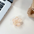 Close-up of pink flower phone socket with sparkling sequins and transparent base - Sakura Holder Macaron Sequin No. 7
