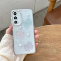 Detalle de la funda transparente con purpurina, lazos de resina 3D y adornos de perlas - Marco Galvanizado - Resina Epoxi Con Diseño De Cielo Estrellado - Lazo Azul-morado-rosa Láser / Samsung A16