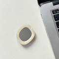 Detail showing the cream-colored rhinestone dolphin mirror phone socket on a desk - Transparent Grip - Shell Fan Mirror - Cream White