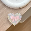 Macro shot of laser heart magnetic phone stand with pink bow and inlaid rhinestones - Transparent Stand - Shell Heart - Jelly Bow / Pink