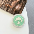 Close-up of a mint green phone grip with rhinestones, silver dolphin, and heart patterns - White Zirconia-Dark Green (Magnetic Glitter Dolphin Mirror)