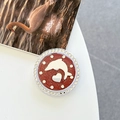 Macro shot of phone grip featuring a red glitter heart, dolphin design, and rhinestones - White Zirconia-Brown (Magnetic Glitter Dolphin Mirror)