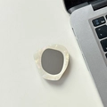 Detail of artistic iridescent shell phone grip with grey inlay against office laptop - Transparent Grip - Shell Stone Mirror - Cream White