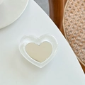 Détail d'un support de téléphone en résine pailletée en forme de cœur avec miroir argenté - Support Miroir Cœur - Cristal à Paillettes / Blanc