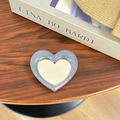 Macro shot of heart-shaped glitter phone mirror on vintage book with warm knit sweater - Heart Mirror Stand / Pearl Silver Gray