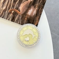 Detailed view of a round phone grip featuring a silver dolphin heart and rhinestones - White Zirconia-Yellow (Magnetic Glitter Dolphin Mirror)