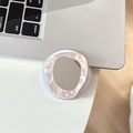 Close-up of a pink marble makeup mirror phone socket on a desk with a laptop - Magnetic Shell Texture Stone Mirror / Pink
