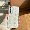 Detail of pearl white sand texture phone case with 3D hearts and pearls for Samsung S24 - Electroplated Frame - White Glitter Drip Glue - Pleated Heart / Samsung A16
