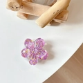 Close-up of a purple 3D flower phone socket with glitter and gold sequins decor - Sakura Grip - Colorful Sequins No.8
