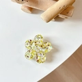 Detail view of yellow glitter flower phone socket stand with 3D acrylic sequins - Sakura Grip - Colorful Sequins No.10