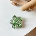 Macro view of green glitter sakura flower griptok made of clear acrylic material - Sakura Grip - Colorful Sequins No.11