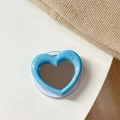 Close-up of blue heart-shaped MagSafe phone grip with splattered texture and makeup mirror - Magnetic Heart Mirror Ink Splash-Light Blue