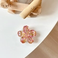 Detailed macro view of 3D cherry blossom phone grip with pink glitter and gold sequins - Sakura Grip - Colorful Sequins No.12