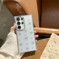 Detail of glitter transparent Samsung S24 Ultra case with gold bow and white pearls - Samsung A16 / Electroplated Frame - Glitter Resin - Silver Bead Bow