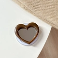 Detail of a heart-shaped magnetic phone holder with a makeup mirror and coffee-colored frame - Magnetic Heart Mirror Ink Splash-Caramel