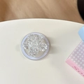 Detalle del soporte móvil de flor con purpurina plateada y base magnética blanca redonda - Magnético - Flor de Cerezo con Lentejuelas Brillantes / Blanco