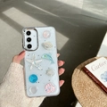 Funda S25 Ultra con dijes 3D océano incluyendo estrella de mar y delfín con purpurina - Marco Galvanizado-Estrellado-Delfín Concha(Samsung A16)