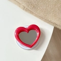 Detail of red heart-shaped MagSafe phone grip with black polka dots and a built-in mirror - Magnetic Heart Mirror Ink Splash-Rose Red
